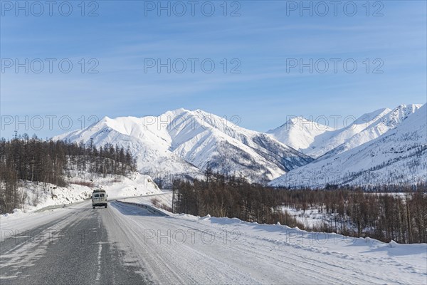 Minivan driving on the Road of Bones