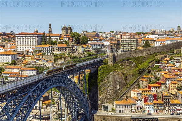 Beautiful panorama of city of Porto with metro on famous bridge