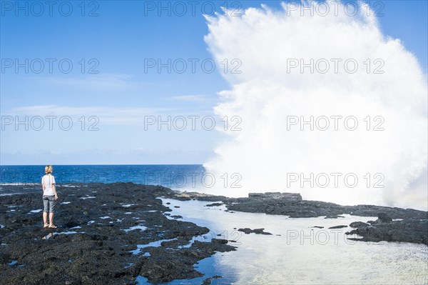 Tourist enjoying the huge waves in the Alofaaga blowholes on the south of SavaiÂ´i