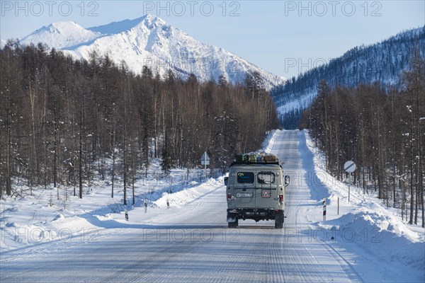 Minivan driving on the Road of Bones