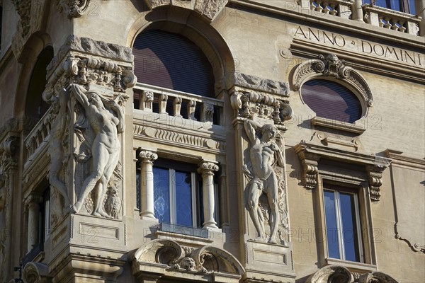 Reliefs of naked woman on the Palazzi degli Ambasciatori Embassy palaces with archway to the Quartiere Coppede