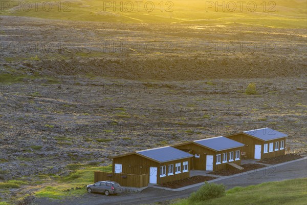 Cabins at the edge of the lava field