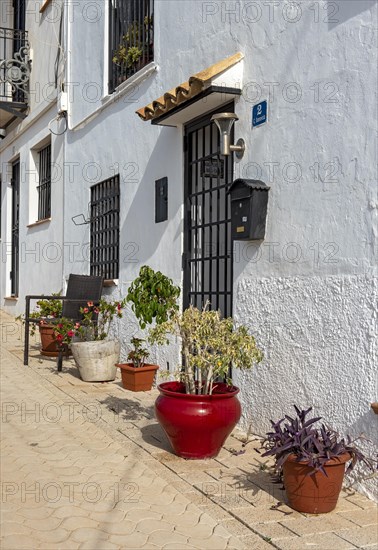 Colorful flowerpots outside white houses of Altea Old Town