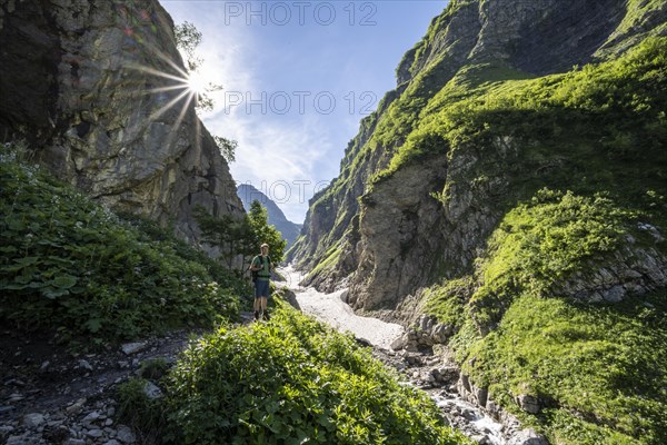 Hikers by a stream