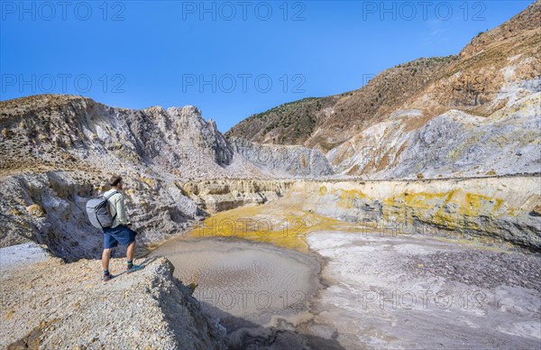 Young man at the crater rim