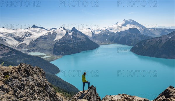 Young man standing on a rock