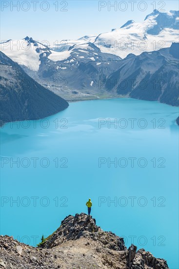 Young man standing on a rock