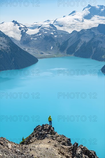 Young man standing on a rock