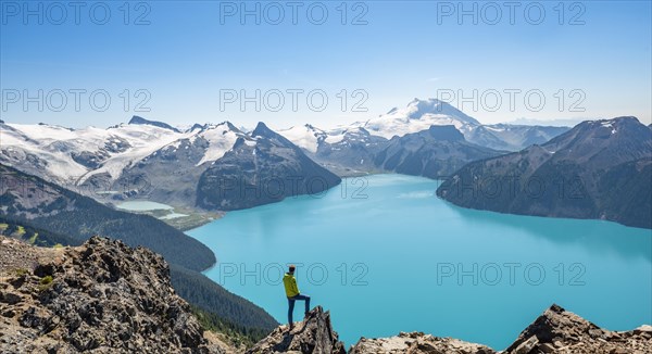 Young man standing on a rock