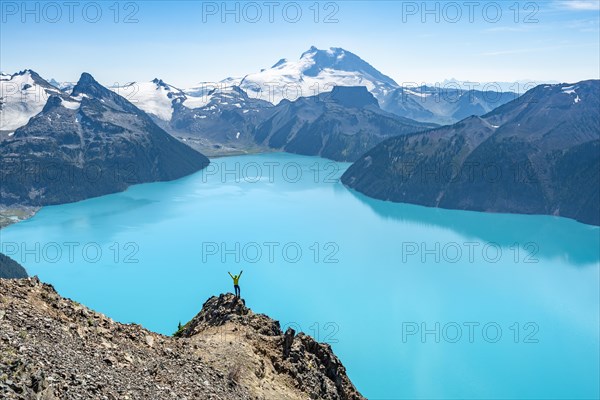 Young man standing on a rock