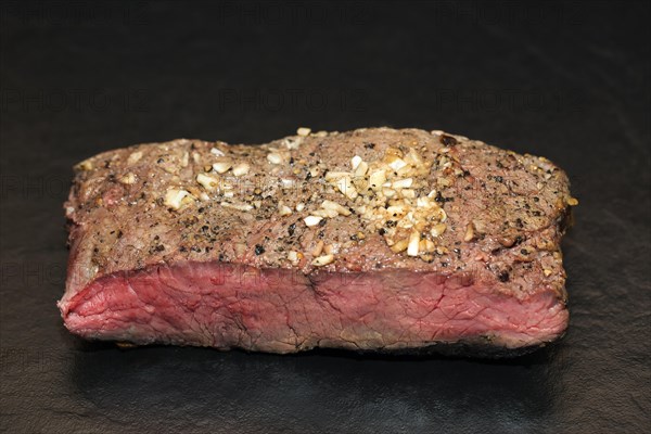 Medium roasted beef roast beef in pepper garlic coating