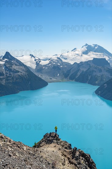 Young man standing on a rock