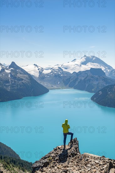 Young man standing on a rock