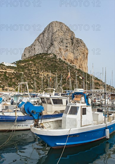 Boats and yachts at Calp (Calpe) harbor and Penyal d'Ifac rock