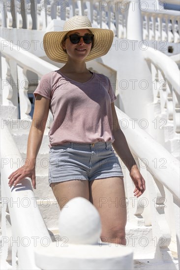 Woman walking on curved stairs