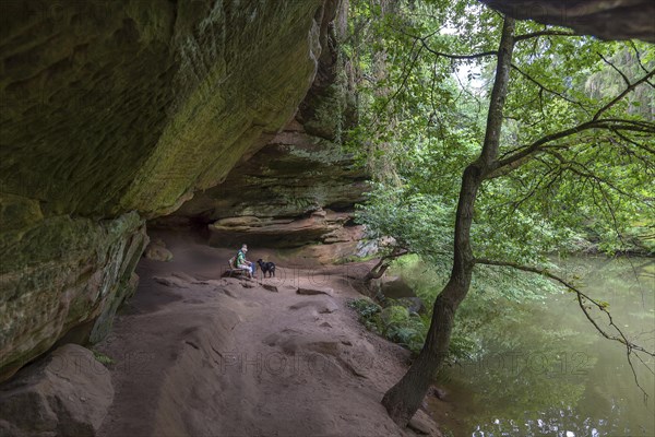 Rock cave in the Schwarzachklamm gorge with the Schwarzach river