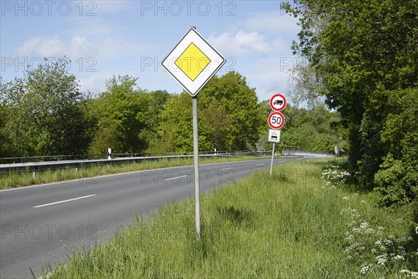 Road sign "Vorfahrtstraße" on a country road