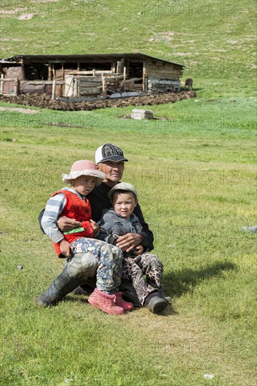 Kyrgyz man with his two children