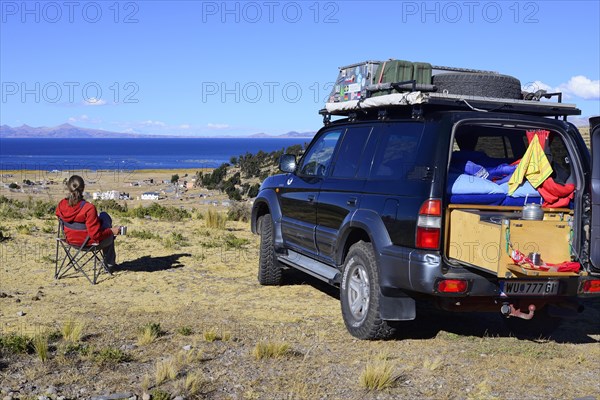 Woman next to an off-road vehicle