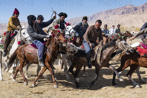 Men practising a traditional Buzkashi game