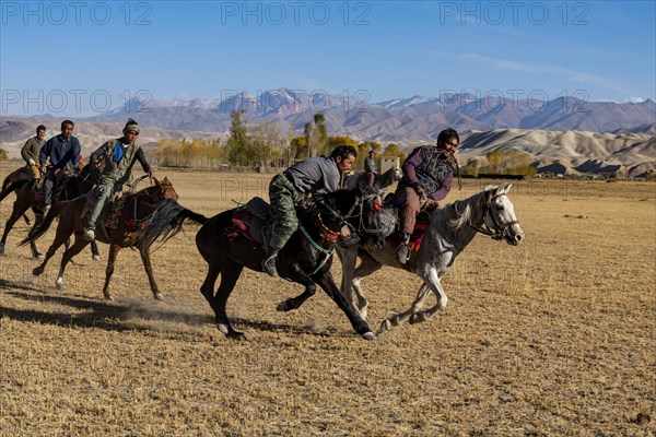 Men practising a traditional Buzkashi game