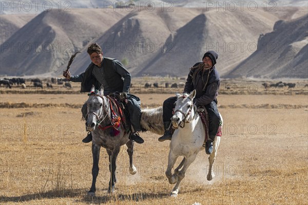 Men practising a traditional Buzkashi game