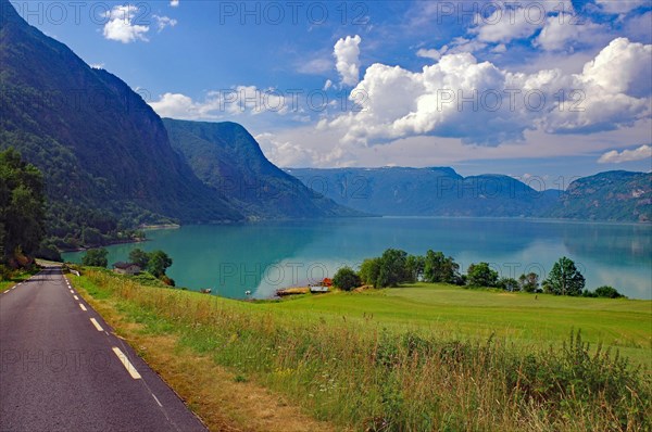 Narrow road by a fjord