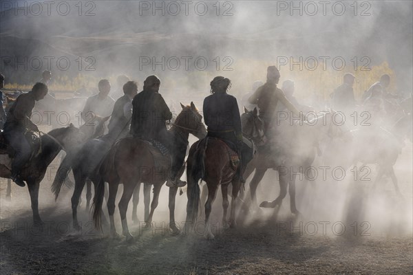 Men practising a traditional Buzkashi game