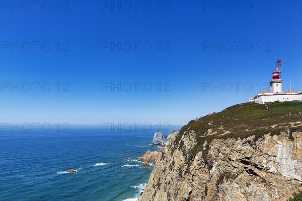 Lighthouse on rocky coast on the Atlantic Ocean