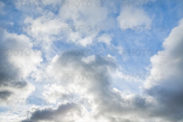 Stratocumulus clouds and blue sky windows form spectacular cloud formation in the sky during Foehn storm