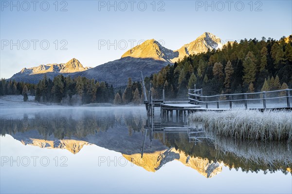 Mountain peaks reflected in Lake Staz