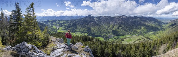 Hiker looking over the Chiemgau valley