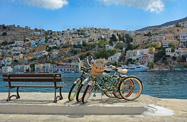 Three bicycles and view of the houses in Symi