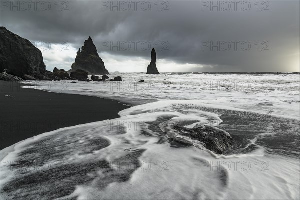 Lava rocks and rock needles on the black lava beach Reynisfjara