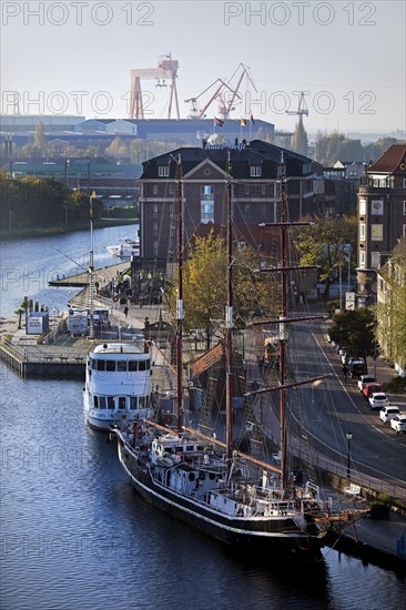 City view from the town hall tower with three-masted barquentine Heureka in the Ratsdelft