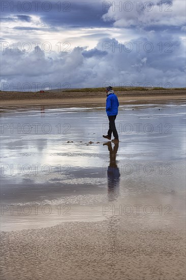 Walkers on the beach