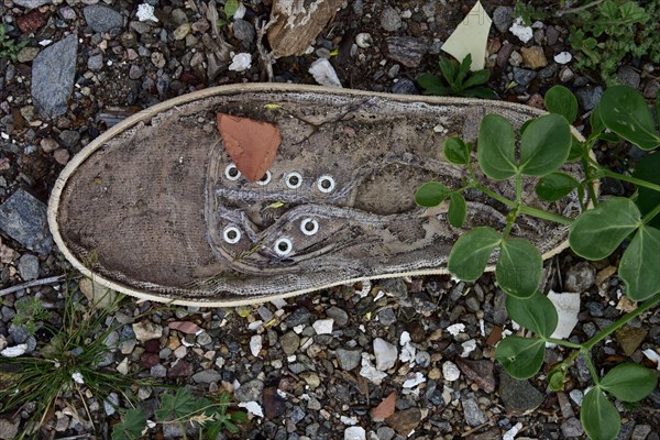 Light linen shoe with leaves on the bottom from above