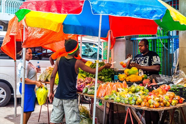 Fruit stall in front of Sir Selwyn Selwyn Clarke Market