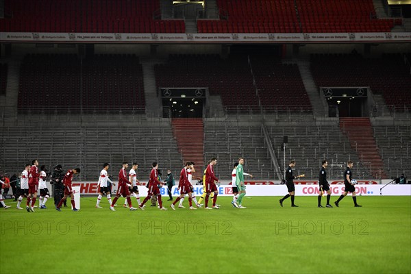 FC Bayern Munich FCB and VfB Stuttgart teams enter the pitch in front of empty stands