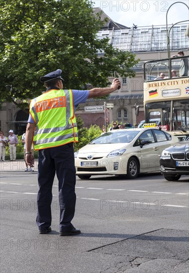 Police officer regulates traffic during a demonstration