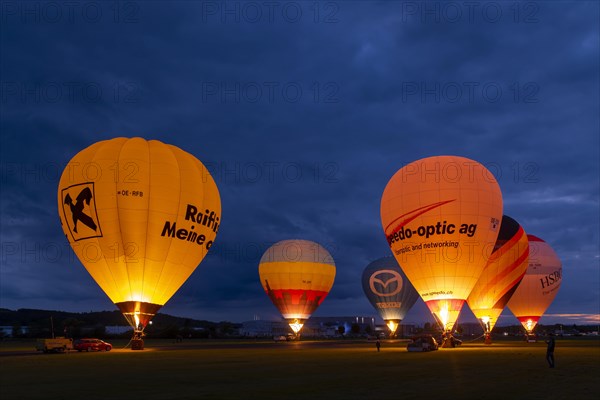 Hot air balloons on the ground during balloon lighting