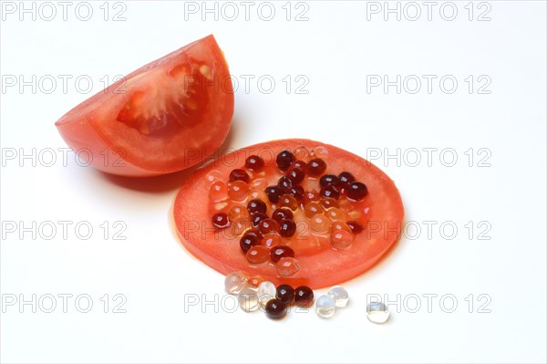 Aceto pearls on tomato slice