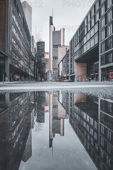 Reflection of the Commerzbank skyscraper or Commerzbank Tower at rain