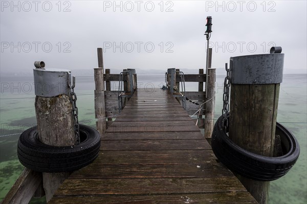 Empty shipping pier in autumn rain