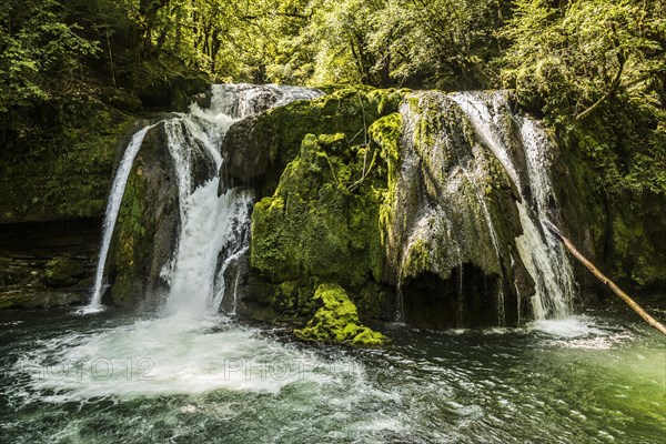 Waterfall and mossy rocks