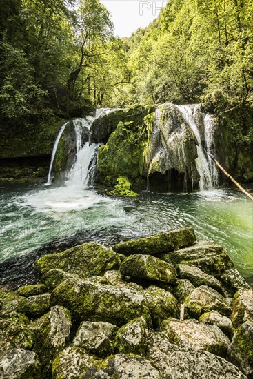 Waterfall and mossy rocks