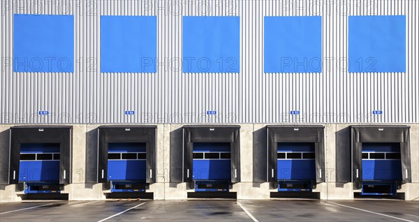 5 blue loading ramps at warehouse