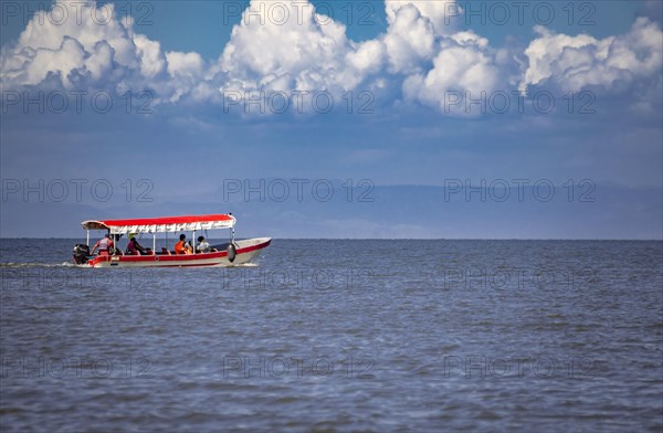 People sailing in a boat on Lake Nicaragua