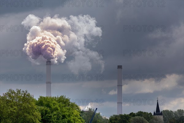 Smoking industrial chimney from Klingenberg power station in Rummelsburg