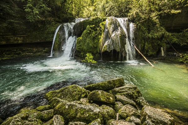 Waterfall and mossy rocks